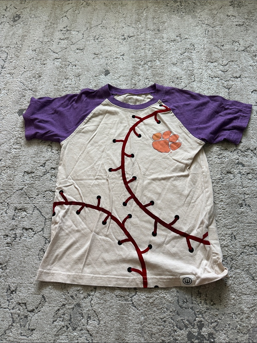 Girls Cream Baseball Tee with Purple Raglan Sleeves and Orange Paw Graphic